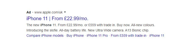 A Google search ad for the iPhone 11 from Apples UK website. Highlights include monthly payments from £22.99, trade-in offers, features like an Ultra Wide camera, all-day battery, and A13 Bionic chip. Links to compare models and buy options.