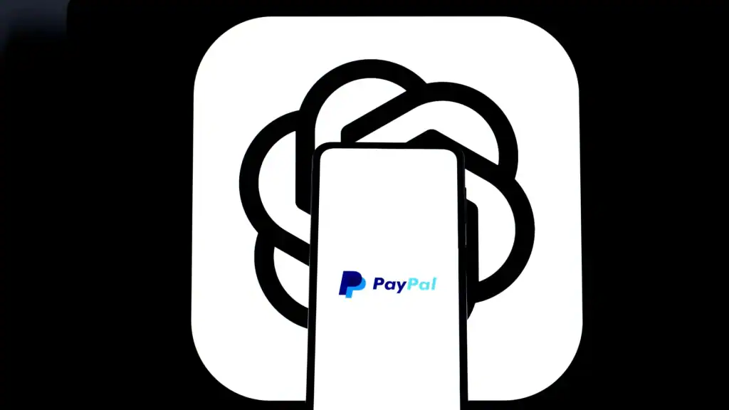 Smartphone displaying PayPal logo against the ChatGPT background, representing PayPal’s AI checkout integration within ChatGPT.