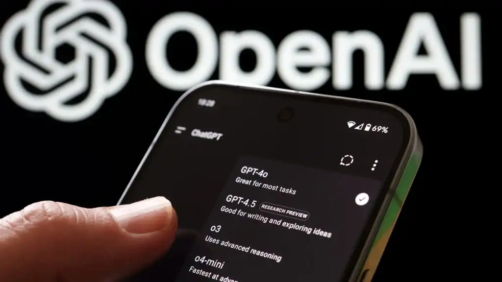 Close-up of someone holding a phone with ChatGPT open on the screen, with the Parent Company, OpenAI's logos in the background indicating to brands that it's important to consider how to rank in ChatGPT as user behaviour shifts to AI Search.