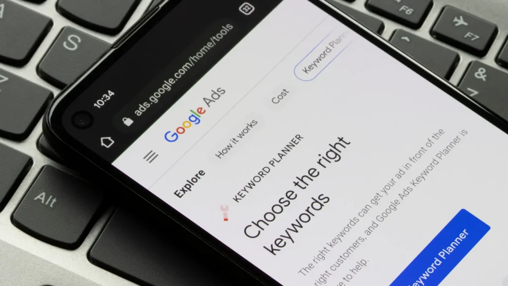 Smartphone displaying the Google Ads Keyword Planner interface, showing keyword planning tools used for PPC keyword research and paid search strategy