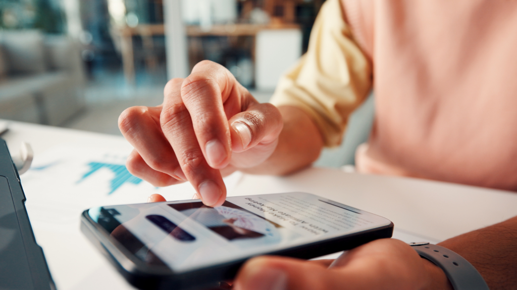 Close-up of a person holding and using a smartphone, highlighting the importance of mobile user friendliness and responsive website design
