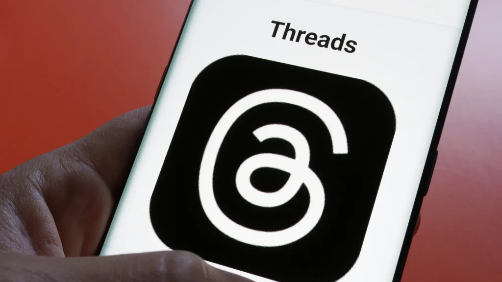 Close-up of the Threads app logo on a mobile device, representing Meta’s global expansion of Threads ads and new paid social advertising opportunities.