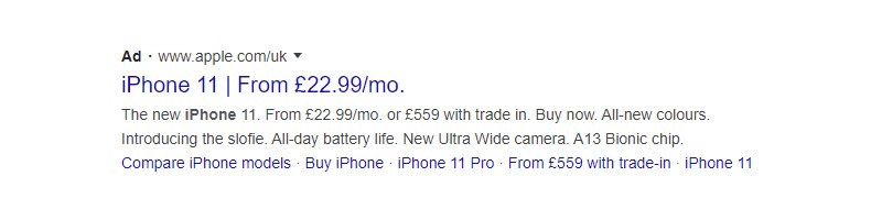 A Google search ad for the iPhone 11 from Apples UK website. Highlights include monthly payments from £22.99, trade-in offers, features like an Ultra Wide camera, all-day battery, and A13 Bionic chip. Links to compare models and buy options.
