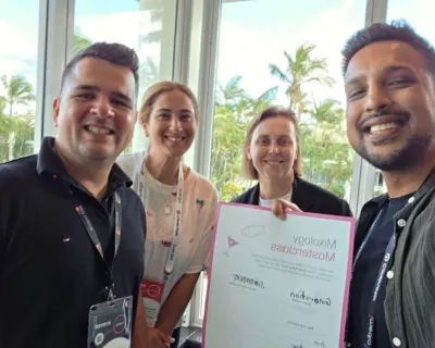 OMG team holding a Mailchimp Masterclass certificate at the Franchise and New Business Expo