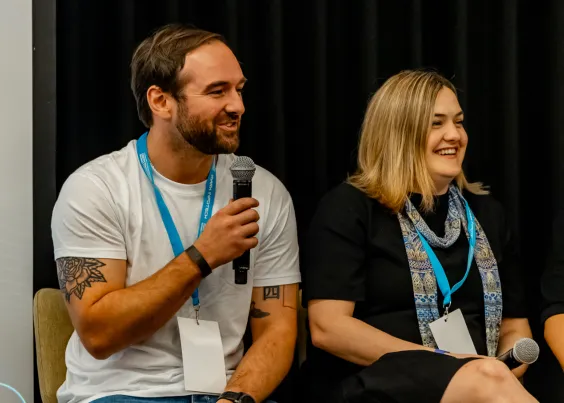 Matt from OMG speaking on a panel discussion at an industry event