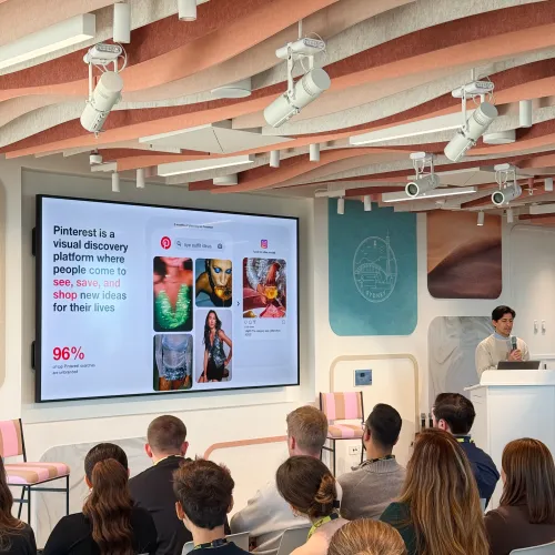Pinterest presenter introducing the visual discovery platform to attendees at the OMG and Pinterest 2025 event