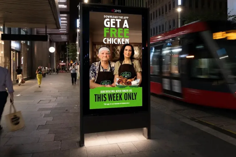 El Jannah free chicken app download campaign on a digital street billboard in Sydney