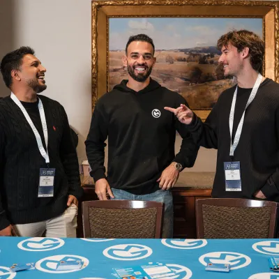 Saf, Andrew and Liam from OMG sharing a laugh at an industry event in Melbourne