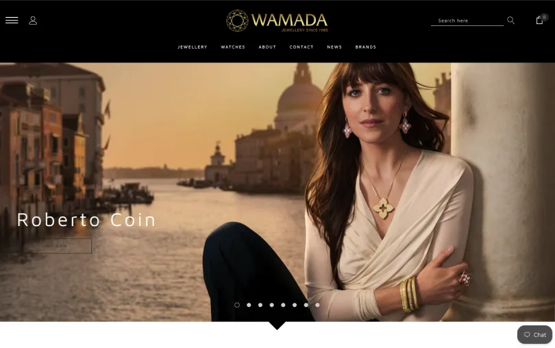 Wamada Jewellery homepage featuring a Roberto Coin campaign with a model wearing gold and gemstone jewellery beside a Venetian canal