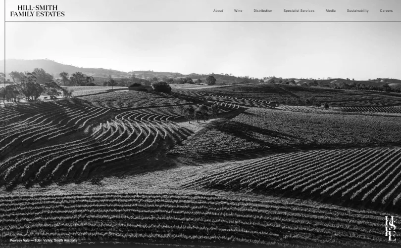 Hill-Smith Family Estates homepage featuring a black and white aerial view of contoured vineyard rows at Pewsey Vale in the Eden Valley, South Australia